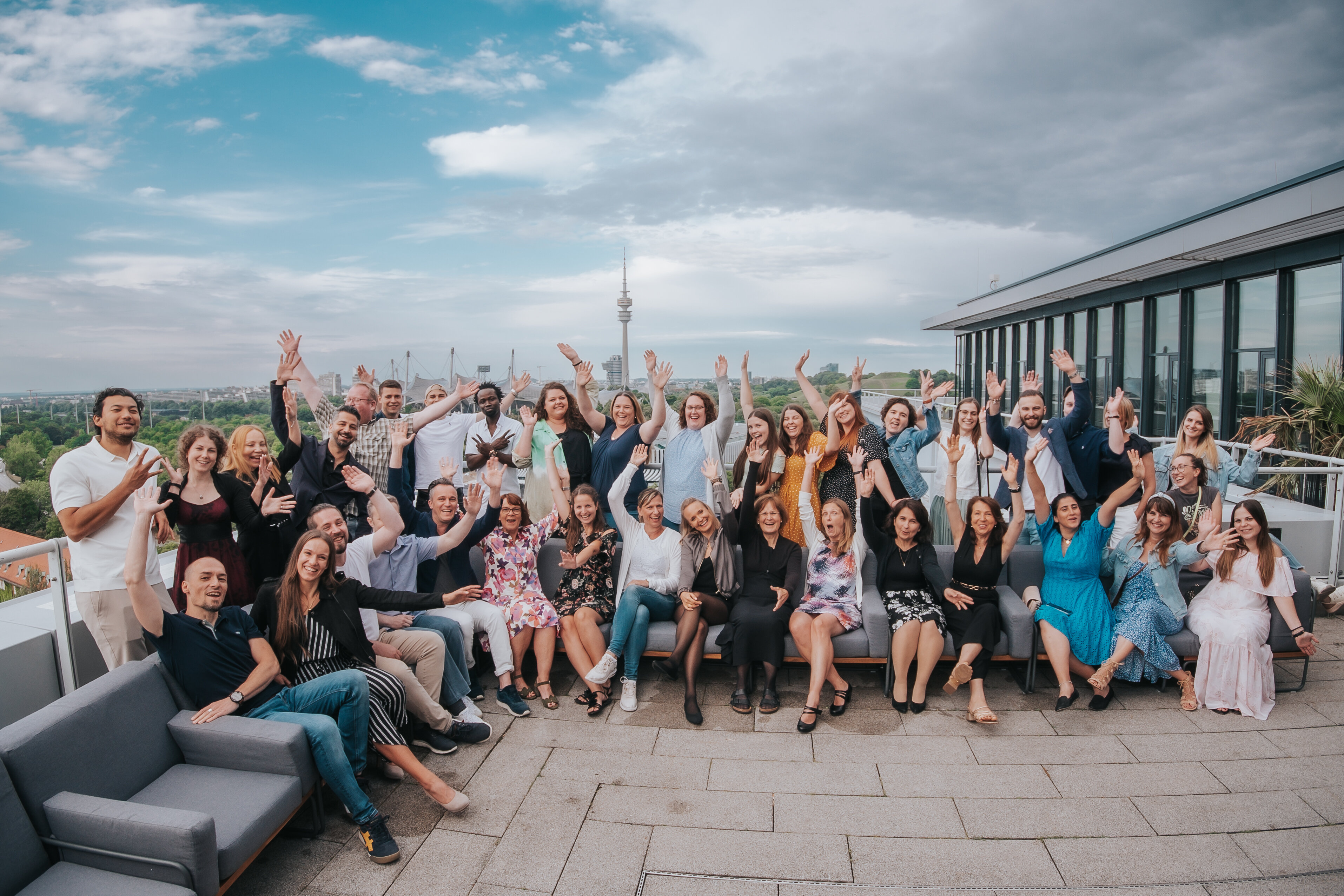 Joyful team raising arms
