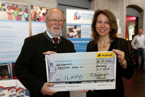 People holding a check